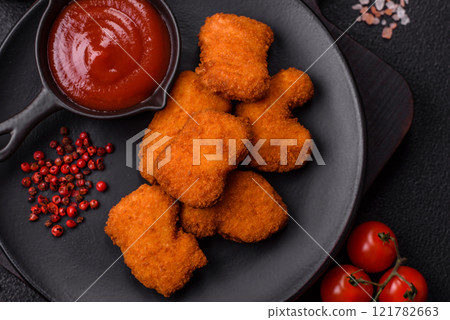 Delicious fresh crispy chicken nuggets, unhealthy food, fast food Delicious fresh crispy chicken nuggets, unhealthy food, fast food 121782663