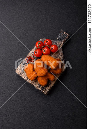 Delicious fresh crispy chicken nuggets, unhealthy food, fast food Delicious fresh crispy chicken nuggets, unhealthy food, fast food 121782670
