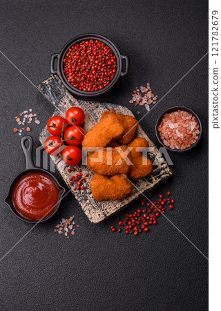 Delicious fresh crispy chicken nuggets, unhealthy food, fast food Delicious fresh crispy chicken nuggets, unhealthy food, fast food 121782679