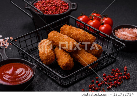 Delicious crispy cheese sticks with mozzarella, salt and spices Delicious crispy cheese sticks with mozzarella, salt and spices 121782734