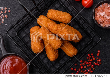 Delicious crispy cheese sticks with mozzarella, salt and spices Delicious crispy cheese sticks with mozzarella, salt and spices 121782735