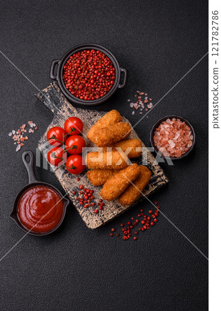 Delicious crispy cheese sticks with mozzarella, salt and spices 121782786