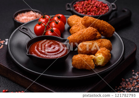Delicious crispy cheese sticks with mozzarella, salt and spices 121782793