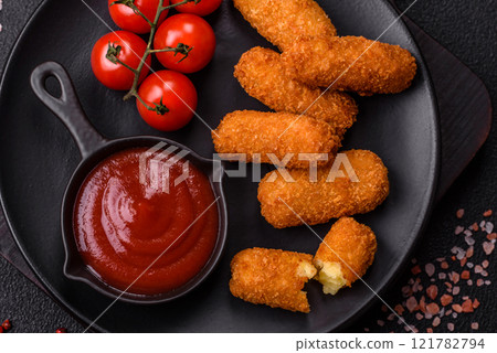 Delicious crispy cheese sticks with mozzarella, salt and spices 121782794