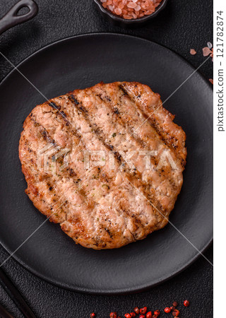 Juicy grilled beef or pork steak with salt, spices and herbs Juicy grilled beef or pork steak with salt, spices and herbs 121782874