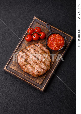 Juicy grilled beef or pork steak with salt, spices and herbs Juicy grilled beef or pork steak with salt, spices and herbs 121782880