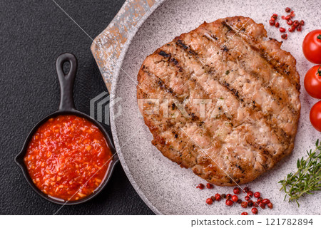 Juicy grilled beef or pork steak with salt, spices and herbs Juicy grilled beef or pork steak with salt, spices and herbs 121782894