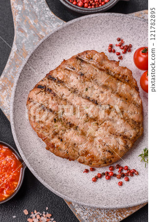 Juicy grilled beef or pork steak with salt, spices and herbs Juicy grilled beef or pork steak with salt, spices and herbs 121782895