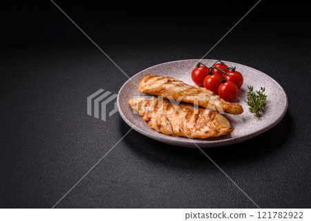 Delicious fresh grilled chicken fillet with spices and herbs Delicious fresh grilled chicken fillet with spices and herbs 121782922