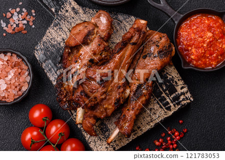 Ribs or rack of beef baked on the grill with salt, spices and herbs Ribs or rack of beef baked on the grill with salt, spices and herbs 121783053