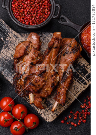 Ribs or rack of beef baked on the grill with salt, spices and herbs Ribs or rack of beef baked on the grill with salt, spices and herbs 121783054
