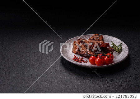 Ribs or rack of beef baked on the grill with salt, spices and herbs 121783058