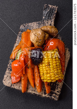 Grilled vegetables peppers, tomatoes, zucchini, onions, carrots, corn, mushrooms Grilled vegetables peppers, tomatoes, zucchini, onions, carrots, corn, mushrooms 121783075