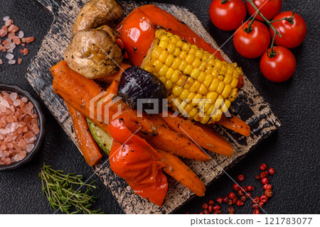 Grilled vegetables peppers, tomatoes, zucchini, onions, carrots, corn, mushrooms 121783077