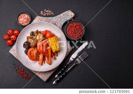 Grilled vegetables peppers, tomatoes, zucchini, onions, carrots, corn, mushrooms 121783091