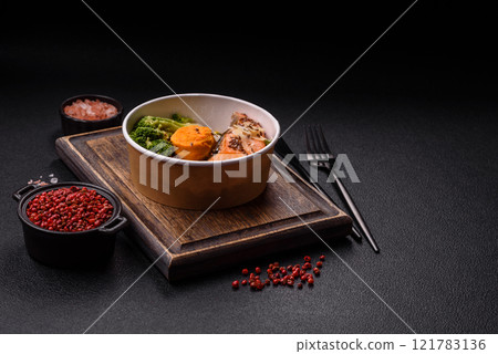 Grilled salmon with salt and spices, broccoli, tomatoes, rice Grilled salmon with salt and spices, broccoli, tomatoes, rice 121783136