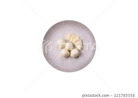 Delicious fresh mozzarella cheese with tomatoes, salt and spices 121783358