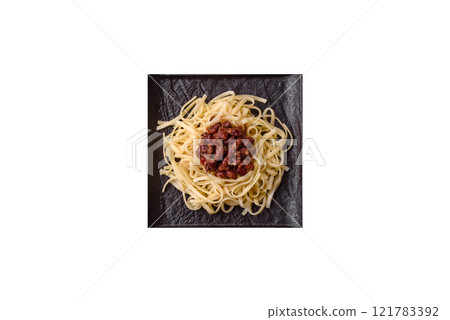 Rice noodles with beans, meat, tomato sauce, spices and herbs Rice noodles with beans, meat, tomato sauce, spices and herbs 121783392