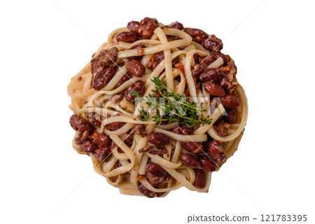 Rice noodles with beans, meat, tomato sauce, spices and herbs Rice noodles with beans, meat, tomato sauce, spices and herbs 121783395
