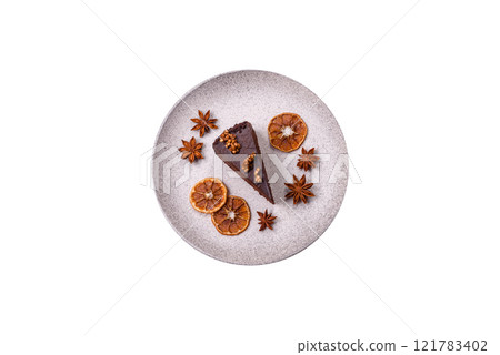 Piece of sweet chocolate cake with nuts Piece of sweet chocolate cake with nuts 121783402