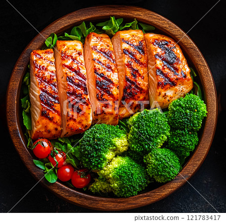 A plate with a healthy vegetarian food dish and vitamin-rich, low-calorie food A plate with a healthy vegetarian food dish and vitamin-rich, low-calorie food 121783417