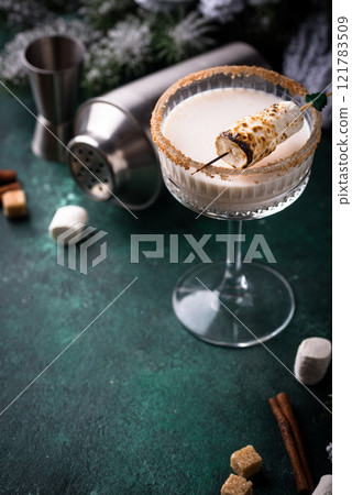Christmas cocktail with toasted marshmellow Christmas cocktail with toasted marshmellow 121783509