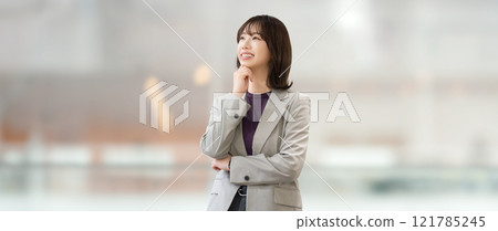 Smiling woman/businesswoman thinking Smiling woman/businesswoman thinking 121785245