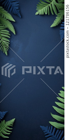 Green fern leaves bordering dark blue background creating copy space 121786156