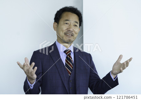 A middle-aged man giving a presentation. Photo courtesy of Tokyo Electronics College, Denpa Gakuen Corporation. 121786451