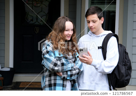 Photo of family young teenagers boyfriend girlfriend use phone look above head amazed social medias info isolated on cyan color background 121786567