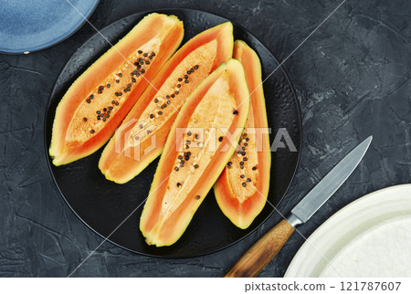Fresh papaya, tropical fruits. 121787607