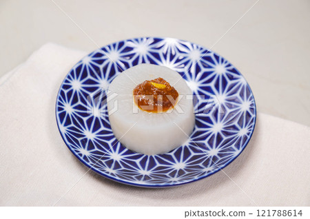 Steamed radish topped with egg yolk miso 121788614