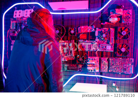 Asian woman wearing a black jacket hacking programming system check hacking hardware circuit in dark office, Cyber security agency developing, Computer electronics and technique 121789110