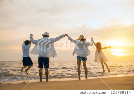 Silhouette of family holding hands live healthy lifestyle on beach, Happy Asian family have fun jumping together on beach in holiday sunset time, Back people enjoying travel trip and summer vacations 121789114