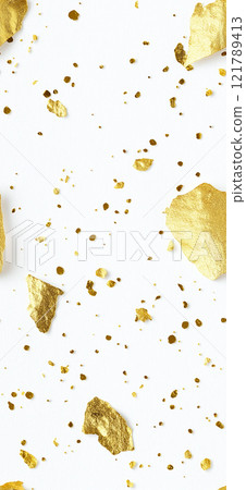 Gold and black paint splattering on white canvas background. Sprinkled gold 121789413