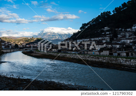 Ancient village and river Osum at dusk in Berat, Albania Ancient village and river Osum at dusk in Berat, Albania 121790302