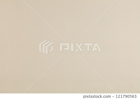 Background of beige evenly textured paper wallpaper. Beige plastered wall. Background of beige evenly textured paper wallpaper. Beige plastered wall. 121790563