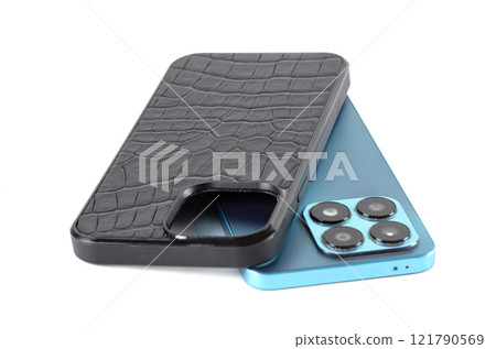 The smartphone case is black crocodile leather on a white background. The smartphone case is black crocodile leather on a white background. 121790569