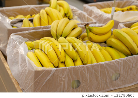 Bananas are packed in packing cases for sale in the store. Bananas are packed in packing cases for sale in the store. 121790605