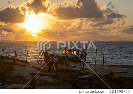 Boat on the beach in a sunset, Torregrotta, Sicily, Italy 121790793