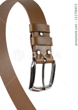 Brown leather belt with metal buckle close-up on a white background. Brown leather belt with metal buckle close-up on a white background. 121790872