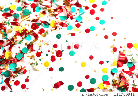 Festive background of multicolored scattered confetti. 121790911