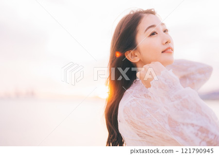 Beauty image with sunset background Beauty image with sunset background 121790945