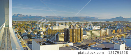 Cityscape view of urban city buildings and infrastructure with background mountains in popular overseas travel destination. Busy downtown centre and urban architecture and blue sky in Bodo, Norway 121791238