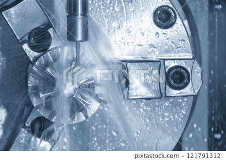 The 4-axis CNC milling machine cutting the turbocharger part with liquid coolant method. The 4-axis CNC milling machine cutting the turbocharger part with liquid coolant method. 121791312