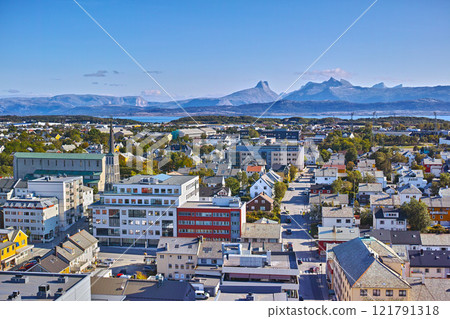 Aerial view of Bodo city in Norway on a sunny day with a blue sky. Scenic modern urban landscape of streets and buildings near a mountain horizon with copy space. Peaceful rural town from above Aerial view of Bodo city in Norway on a sunny day with a blue sky. Scenic modern urban landscape of streets and buildings near a mountain horizon with copy space. Peaceful rural town from above 121791318