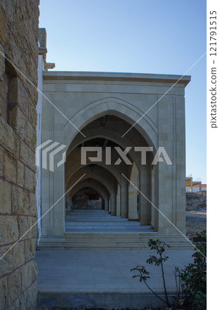 Elegant arches in a historic architectural setting during the golden hour at the ancient site. Elegant arches in a historic architectural setting during the golden hour at the ancient site. 121791515