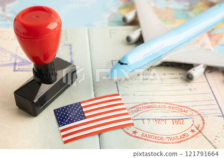 US America flag with passport and airplane for travel. US America flag with passport and airplane for travel. 121791664