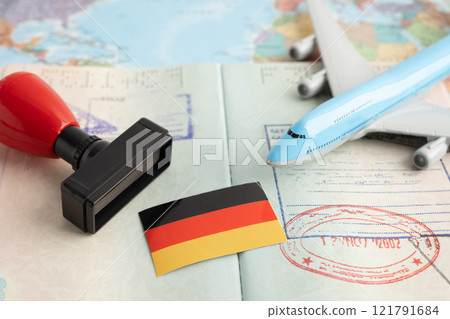 Germany flag with passport and airplane for travel. Germany flag with passport and airplane for travel. 121791684