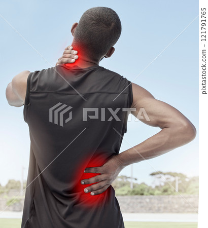 Injured and sore male runner suffering from sudden ache in his neck and back. Muscle strain or injury after a routine workout outdoors. Young sportsman struggling with unbearable pain during practice 121791765
